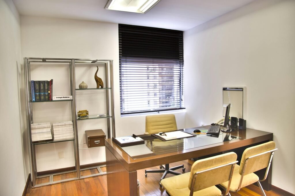 pexels-photo-263209-263209 Sleek and contemporary office space featuring a wooden desk, chairs, and organized shelves.